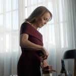 Sylvie’s burgundy knit dress on Emily in Paris