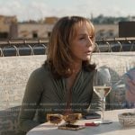 Sylvie’s green plunge neck long sleeve top on Emily in Paris