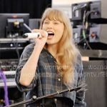 Taylor Swift’s cropped plaid shirt and black denim shorts on The End of an Era