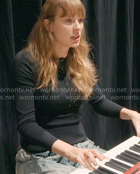 Taylor Swift's black henley top and distressed jeans on The End of an Era