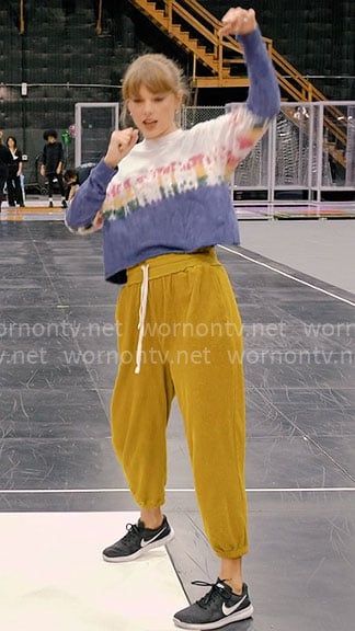 Taylor Swift's tie dye tee and mustard yellow pants on The End of an Era