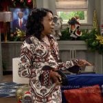 Tina’s black, white, and red printed wrap dress on The Neighborhood