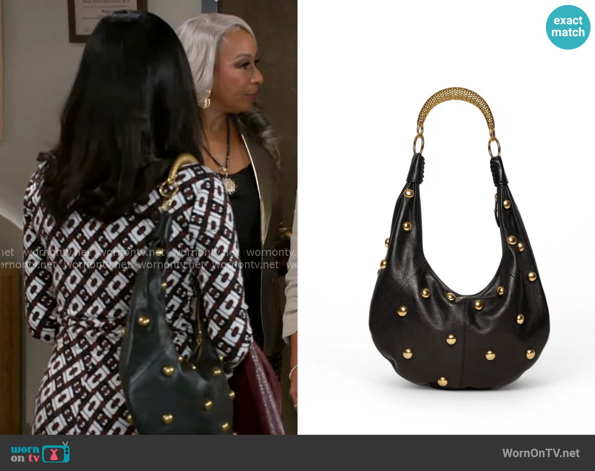 Walter Baker Miller Studded Hobo worn by Dana 'Leslie' Thomas (Trisha Mann-Grant) on Beyond the Gates