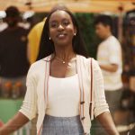 Teedra’s stripe trim cardigan and denim skirt on Bel-Air