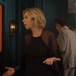 Yvette’s black chiffon dress on Emily in Paris