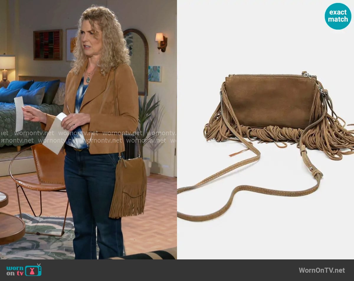 Zara Fringed Split Suede Mini Crossbody Bag worn by Jan Morgan (Jerri Tubbs) on Beyond the Gates