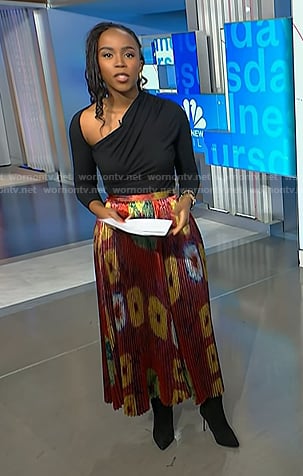 Zinhle’s black asymmetric top and print pleated skirt on NBC News Daily