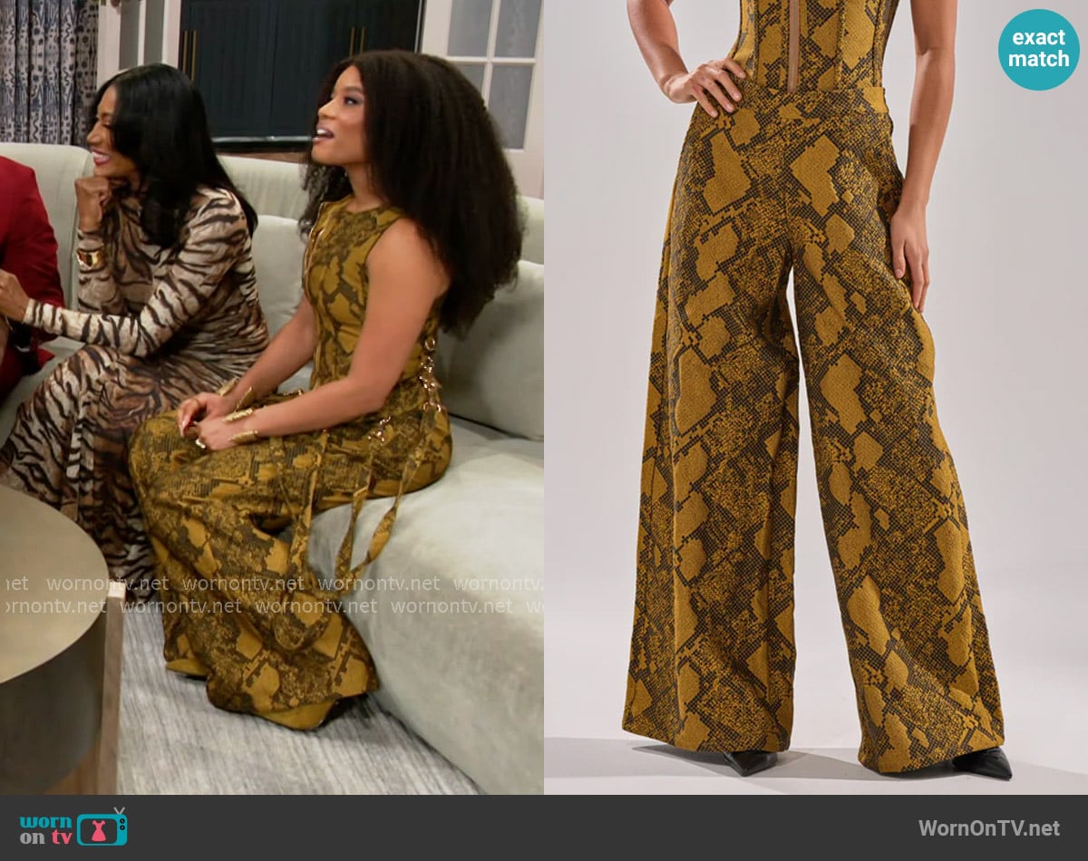 Eva’s yellow snake print pants on Beyond the Gates