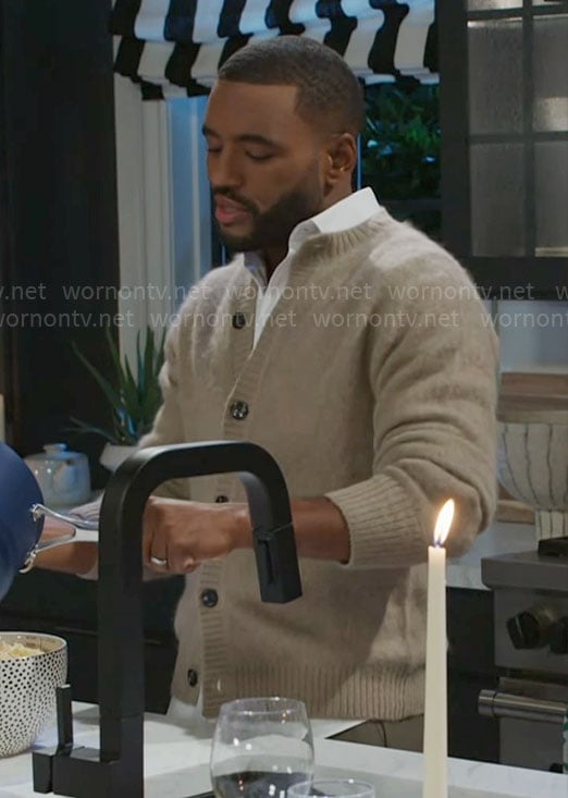 Andre’s beige cardigan on Beyond the Gates