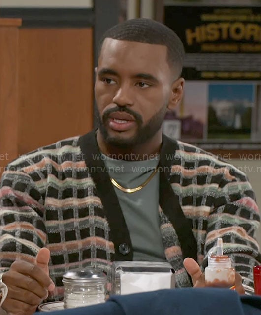 Andre’s checked cardigan on Beyond the Gates