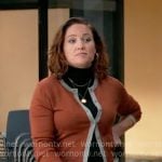 Angie’s orange cardigan with grey trim on Will Trent