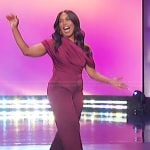 Angela Bassett’s burgundy one off shoulder top and pants on The Jennifer Hudson Show
