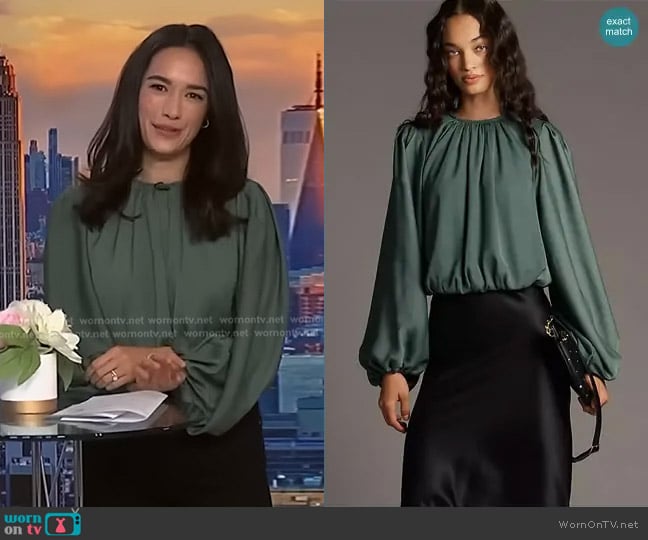 Anthropologie Cropped Puff-Sleeve Bubble-Hem Blouse in Dried Rosemary worn by Emilie Ikeda on NBC News Daily