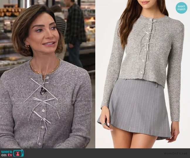 Courtney Lopez’s gray cardigan on Access Hollywood