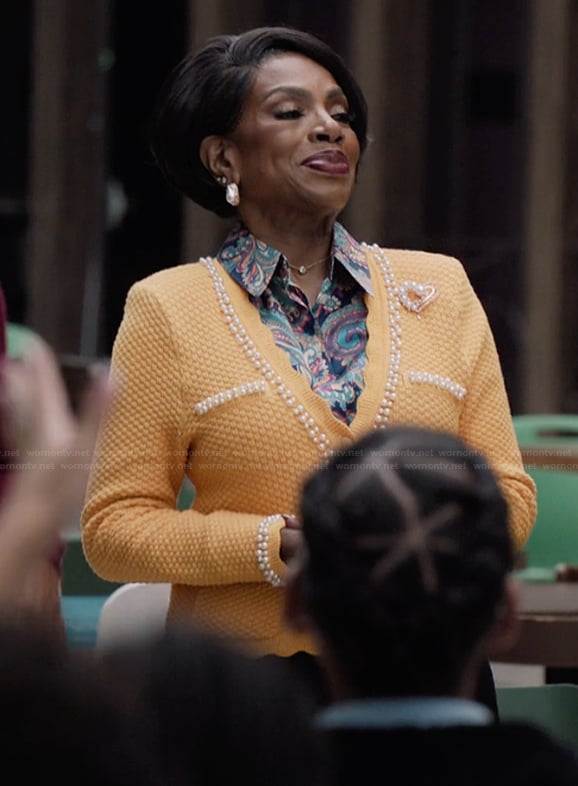 Barbara's orange scalloped cardigan on Abbott Elementary