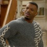 Bernard's gray contrast stitch sweater on The Upshaws