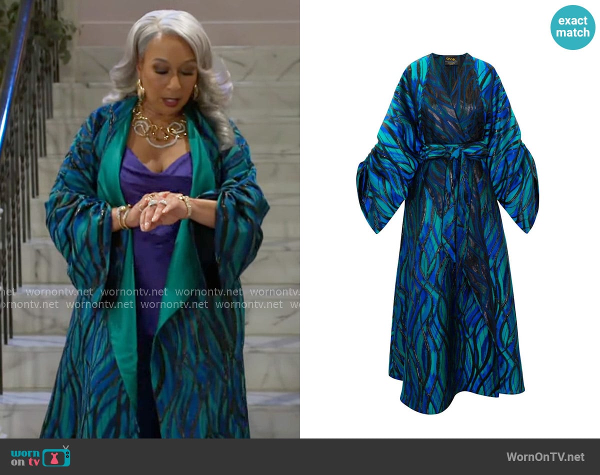 Anita’s teal patterned coat on Beyond the Gates Anita’s teal patterned coat on Beyond the Gates