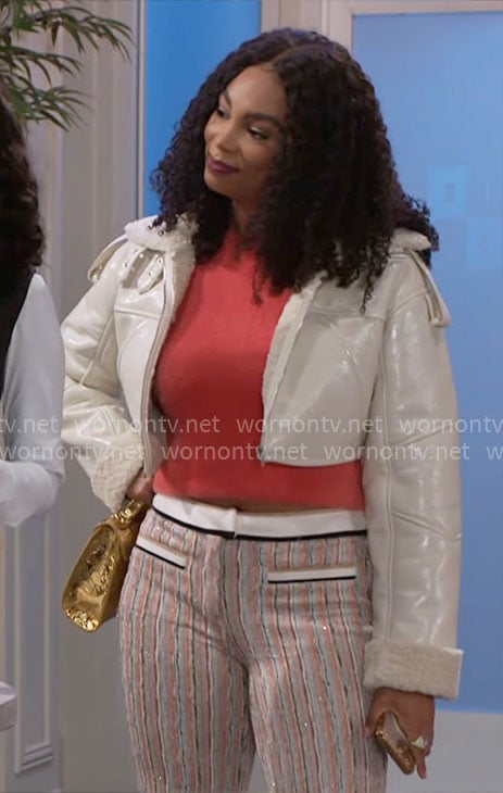 Chelsea’s orange fluffy top, cropped jacket and striped pants on Beyond the Gates