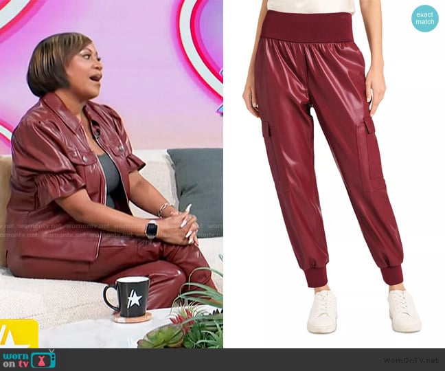 Monique’s burgundy leather pants on Access Hollywood