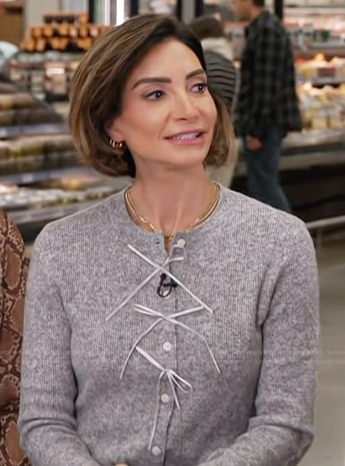 Courtney Lopez’s gray cardigan on Access Hollywood