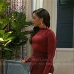 Dani’s red long sleeved top and skirt on Beyond the Gates