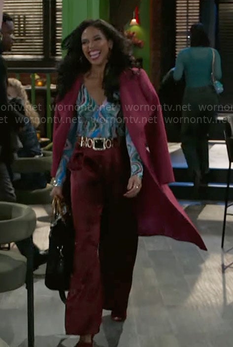 Dani’s pink coat and marbled print top on Beyond the Gates