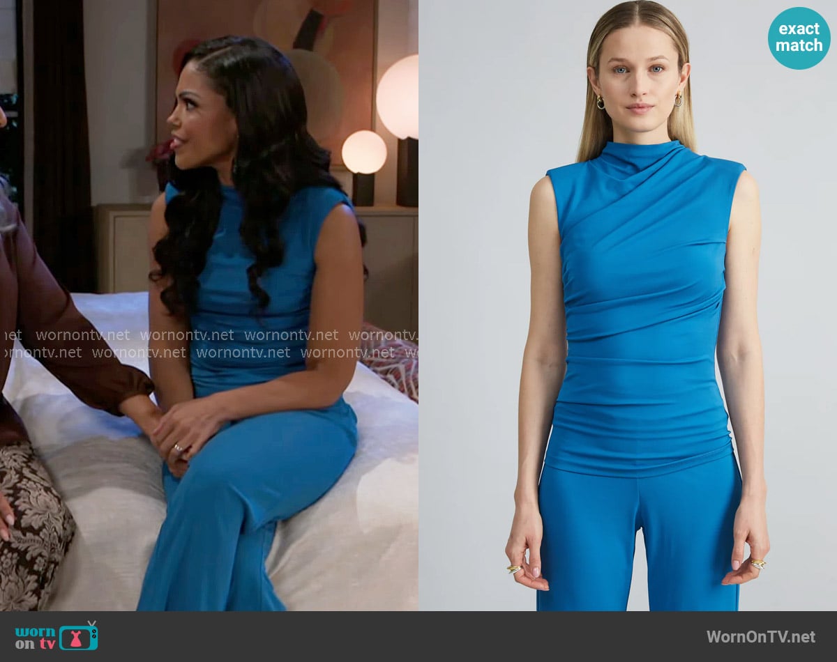 Dani’s blue sleeveless top on Beyond the Gates