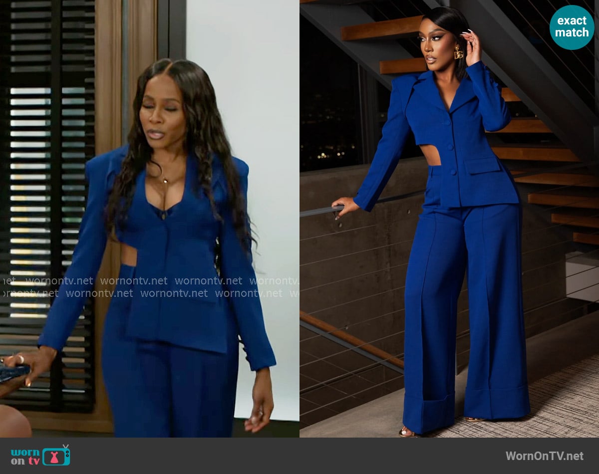 Hayley’s blue cutaway asymmetric suit on Beyond the Gates