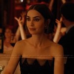 Emily’s embellished earrings and rings on Emily in Paris