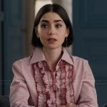 Emily’s gold drop earrings and rings on Emily in Paris