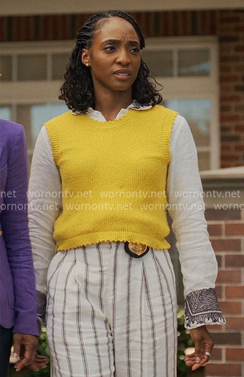 Faith’s yellow sweater vest, striped pants and embroidered shirt on Will Trent