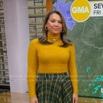 Ginger's yellow turtleneck sweater and green plaid skirt on Good Morning America