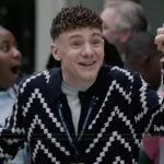 Jacob’s navy stripe knit cardigan on Abbott Elementary