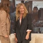 Kelli Giddish’s black pinstripe blazer and pants on The Drew Barrymore Show