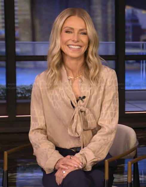 Kelly's beige tie neck blouse on Live with Kelly and Mark