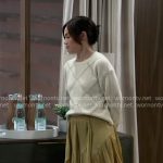 Elizabeth’s cream diamond sweater and green ruffled skirt on General Hospital