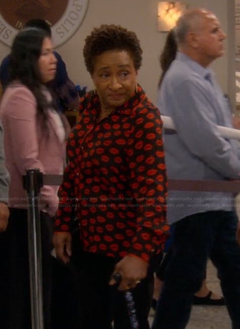 Lucretia’s black lip print blouse on The Upshaws