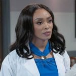 Madison’s blue top with gold detail on Beyond the Gates