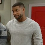 Martin’s grey sweater with cable knit details on Beyond the Gates