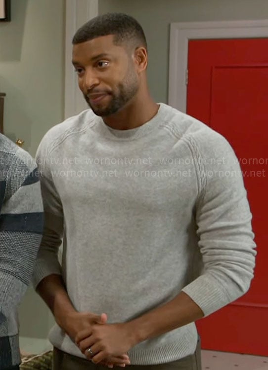 Martin’s grey sweater with cable knit details on Beyond the Gates