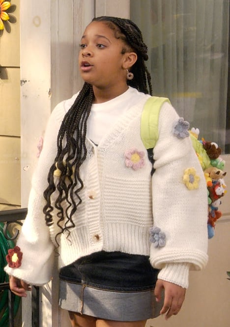Maya's white floral knit cardigan on The Upshaws