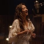 Mindy’s ivory tie neck blouse on Emily in Paris