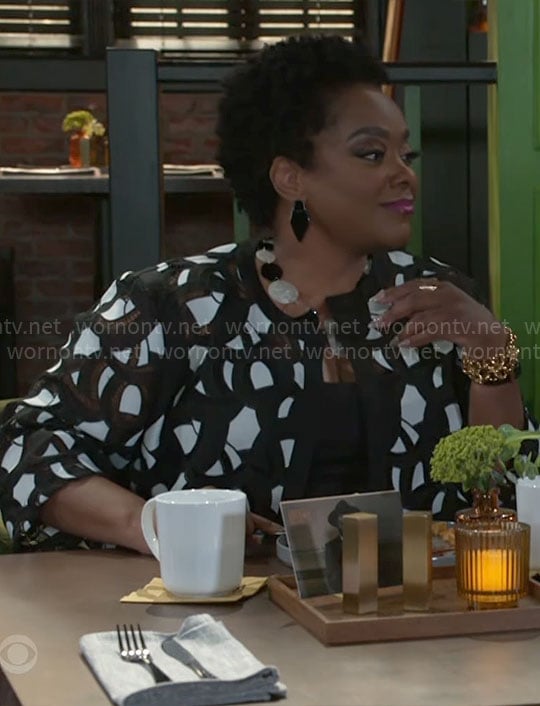 Mona’s black and white jacket on Beyond the Gates