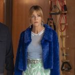 Morgan's blue fur jacket, green printed mini skirt, and fish earrings on High Potential