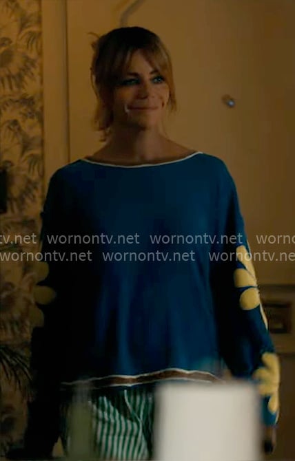 Morgan's blue top with flower sleeves on High Potential