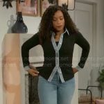 Naomi’s black top with denim trims on Beyond the Gates