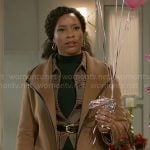 Naomi's tan coat with black leather trims on Beyond the Gates