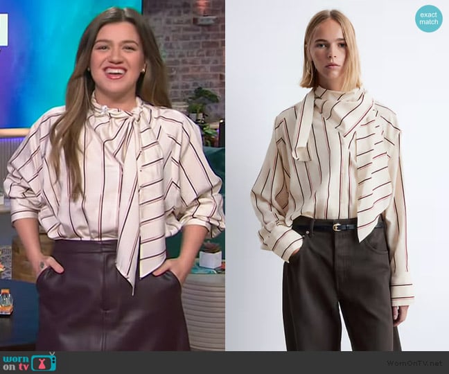 Kelly’s stripe tie neck blouse on The Kelly Clarkson Show Kelly’s stripe tie neck blouse on The Kelly Clarkson Show