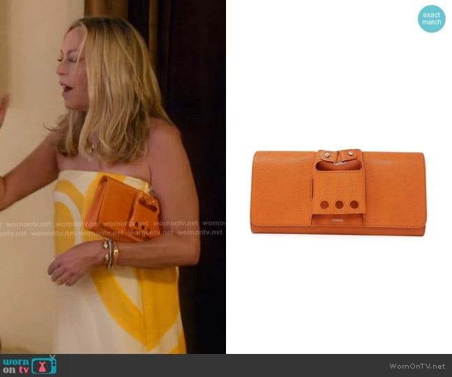 Perrin Paris Muse Clutch in Orange worn by Sutton Stracke on The Real Housewives of Beverly Hills