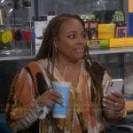 Regina's abstract print wrap blouse on The Upshaws